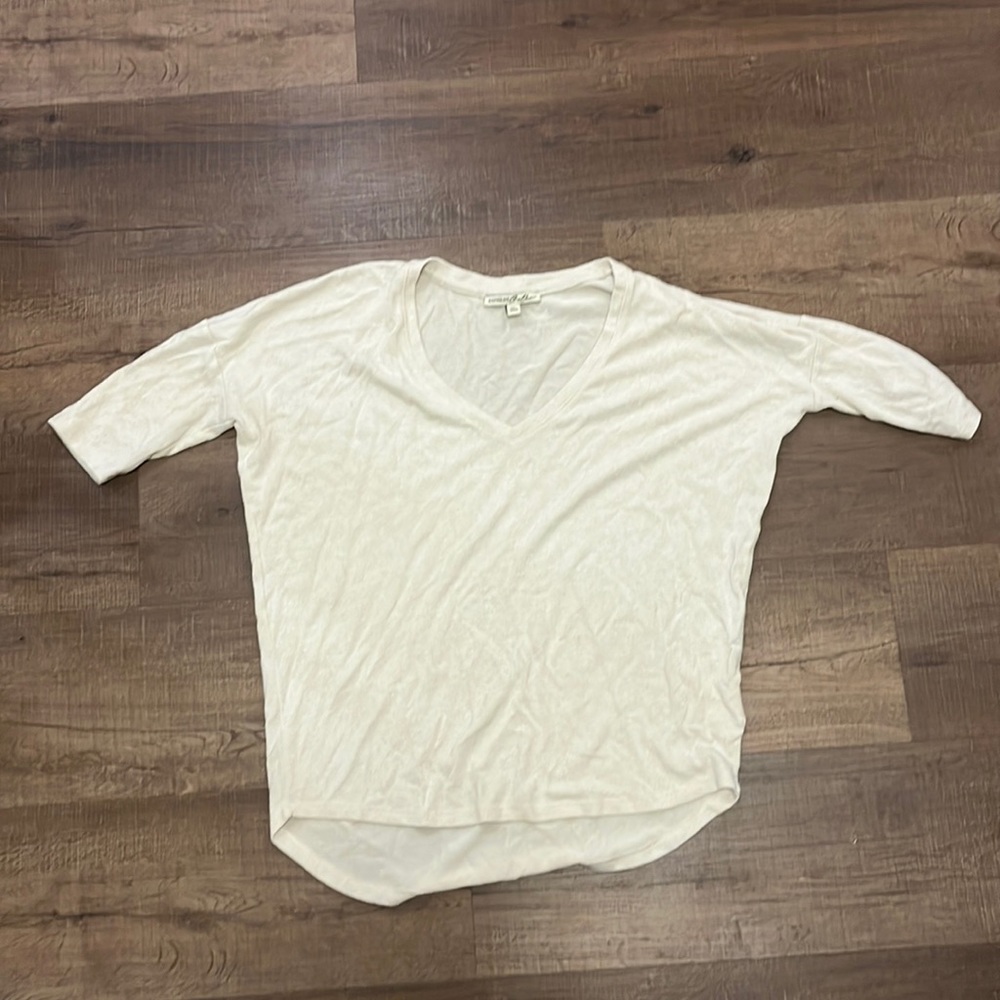 Wide neck cream colored shirt